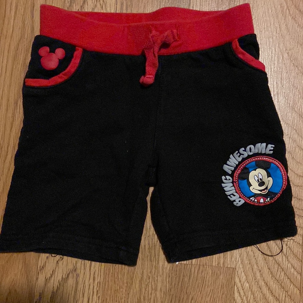 Red and black Mickey Mouse shorts and gray shorts